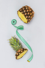 Pineapple cut into pieces and measuring tape