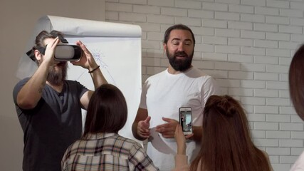 Engaged business professionals exploring virtual reality during an office conference - Powered by Adobe