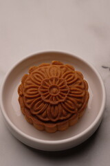 Mooncakes are traditional Chinese pastries, typically enjoyed during the Mid-Autumn Festival