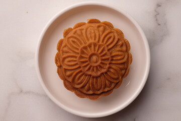 Mooncakes are traditional Chinese pastries, typically enjoyed during the Mid-Autumn Festival