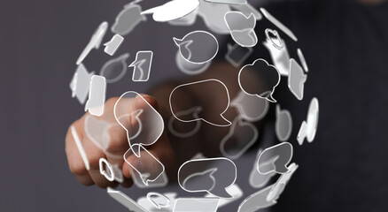 Abstract image depicting a hand interacting with a network of speech bubbles, symbolizing global...