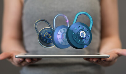 Image of three digital combination locks hovering above a tablet, illustrating online security and...