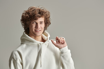 curly guy in hoodie