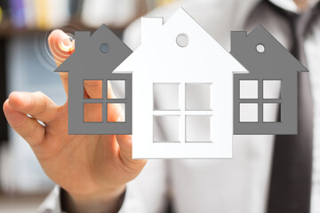 A real estate agent presents various house options to a client using a digital interface.