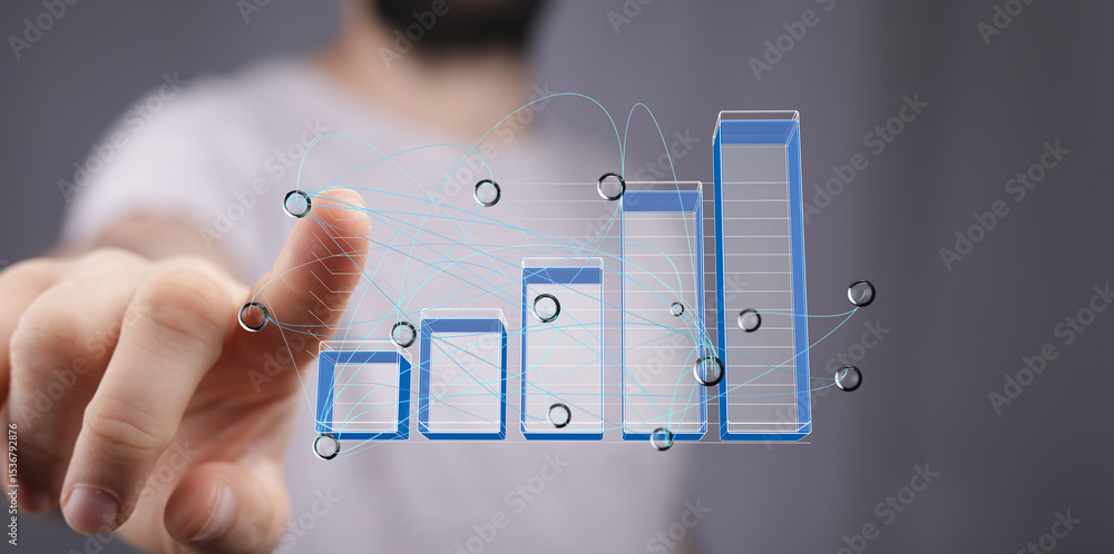 Poster close-up of a businessman interacting with a digital bar chart showing upward growth trend.