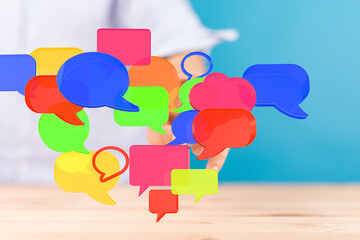 Image of colorful speech bubbles floating, representing communication, social media, and online...