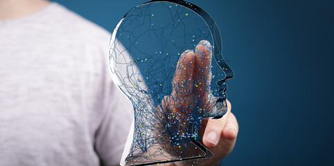 Abstract image of a person interacting with a digital head hologram. Represents AI, technology, and...