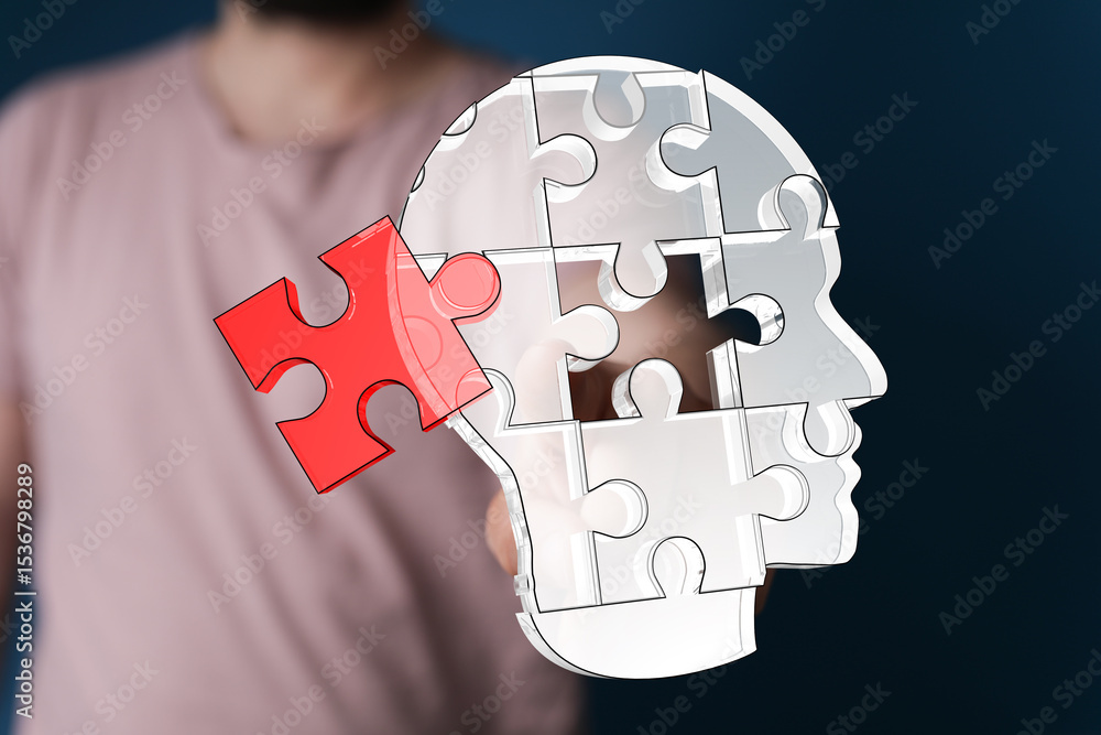 Poster conceptual image of a human head made of puzzle pieces, with one piece being added. represents probl