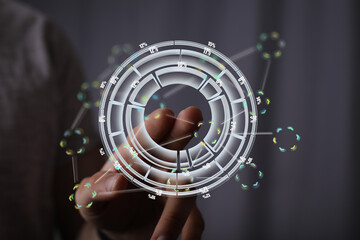 A hand interacts with a holographic circular interface showing data percentages and connections.