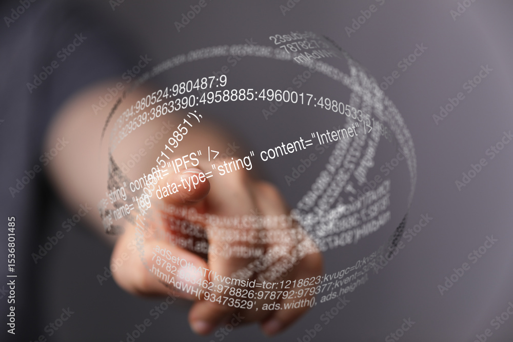 Aufkleber Close-up of a hand interacting with a transparent sphere of digital code, representing data and technology.