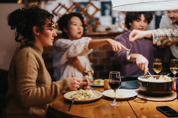 Friends gather around a table, sharing a hearty meal and laughter in a cozy ambiance. Their interactions highlight friendship and warmth, with dishes and glasses of wine enhancing the experience.