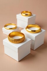 Several golden bracelets artfully displayed on small white gift boxes , gold bracelets, product shot, e-commerce