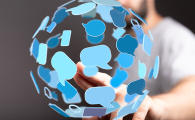 A person interacts with a sphere of communication bubbles, symbolizing global connections and...