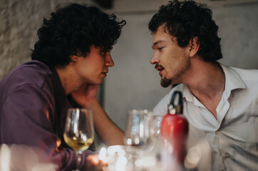 A tender interaction between two young adults sharing a meaningful conversation at a dinner table. Their connection is emphasized by the warm ambiance, wine glasses, and intimate table setting.