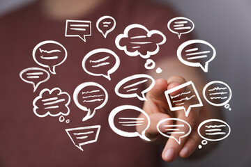 Hand interacts with digital speech bubbles,communication, conversation, feedback, ideas.