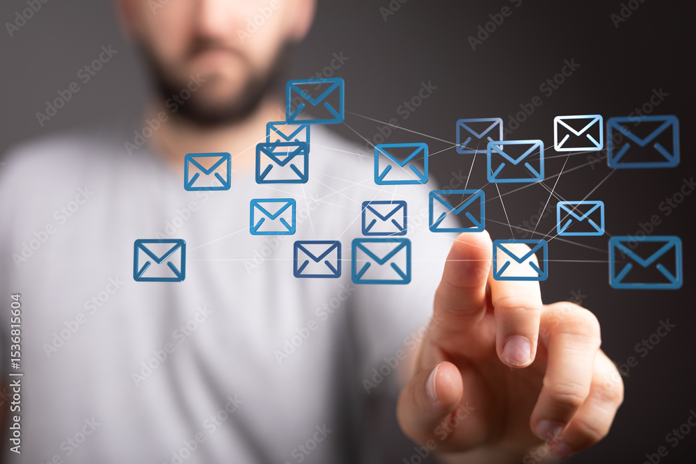 Poster Man interacts with a digital network of email icons, symbolizing global communication and connectivity.