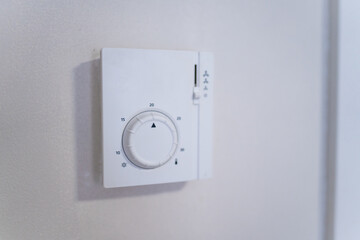 A forced air furnace wall control panel closeup. Heating system for house or apartment.