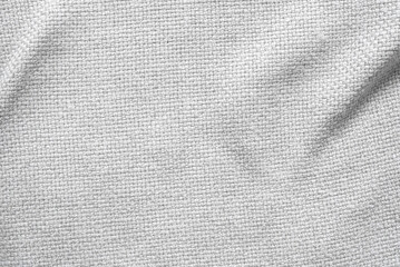 Close-up of white textile fabric, revealing fine weave and soft texture