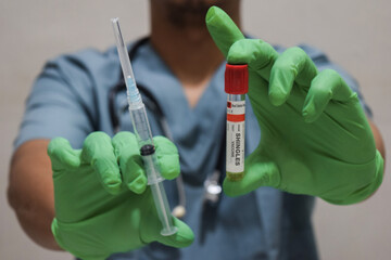Text Shingles vaccine of is written on a bottle with background of a doctor with a syringe in a...