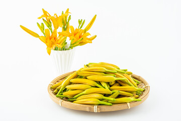 A plate of fresh daylily buds on a white background