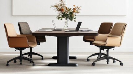 Meeting room with light-colored furniture and a vase of flowers