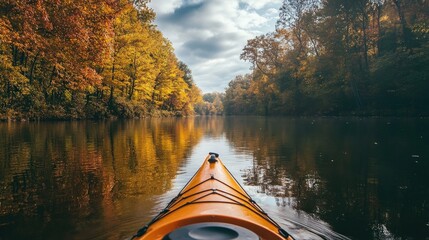 Kayak travels along peaceful river in a beautiful autumn environment