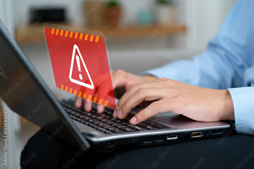 Poster person experiencing a computer error or system warning on laptop