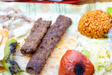Close-up of traditional Turkish shish kebabs on oval plate	