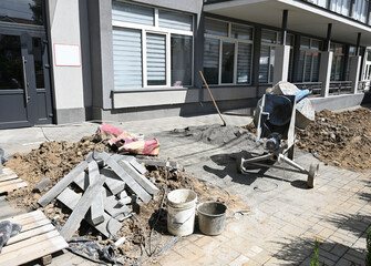 Construction project underway at a commercial building with equipment and materials on site