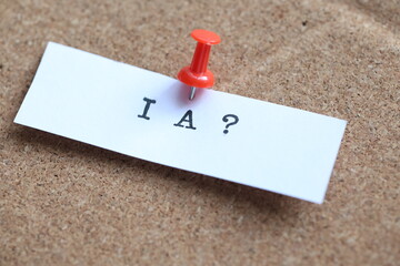 push pin  İA on a cork notice board