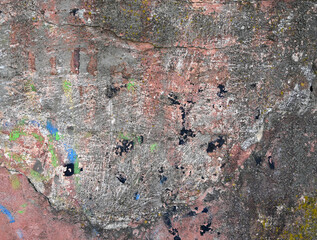 Weathered concrete wall displaying  natural aging in an urban setting