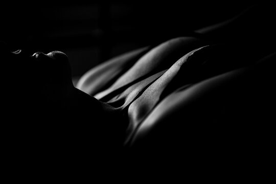 Part of a naked female body close-up. Body-positivity, self-love, acceptance. Concept of femininity and body care