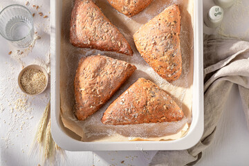 Tasty and brown triangular buns baked in the bakery.