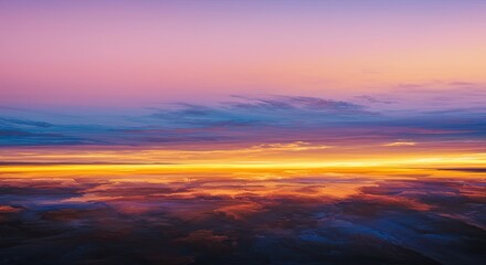 Dramatic sunset sky with vibrant colors reflecting on the clouds below the horizon