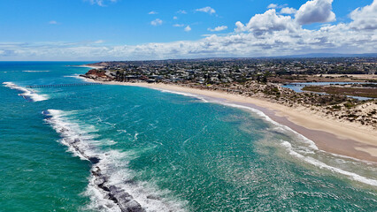 Port Noarlunga Beach, South Australia: 4K Aerial Drone Footage Featuring Scenic Coastline, Long Jetty, Reef Breaks, Red Cliffs, Sandy Beach, and Coastal Town Along the Southern Ocean