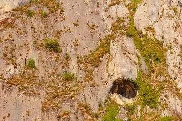 Spring landscape on a sunny day with a cave at Essing, Altmuehltal, Kelheim, Bavaria, Germany