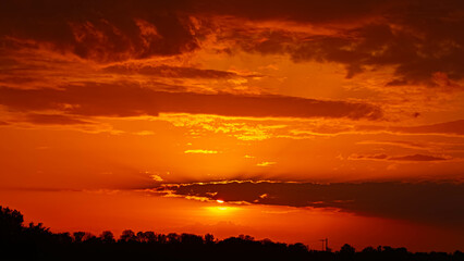 Spring sunset or sundowner view with dramatic clouds near Forstern, Moos, Deggendorf, Bavaria, Germany