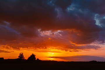 Spring sunset or sundowner view with dramatic clouds near Forstern, Moos, Deggendorf, Bavaria, Germany