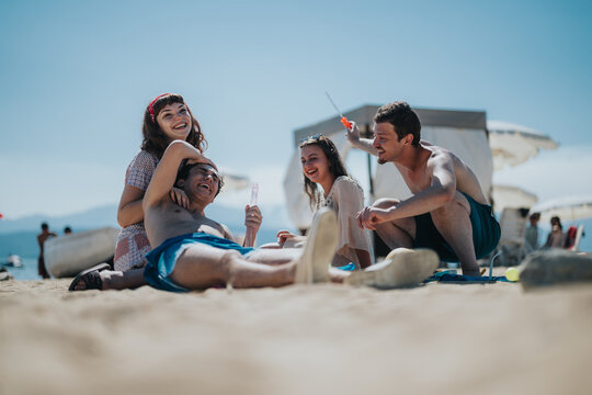 A group of friends spending quality time together at the beach on a sunny day, sharing laughter, and enjoying fun activities surrounded by a lively and warm atmosphere.