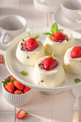 Homemade and delicious monoportion cheesecake flavored with berries and vanilla.