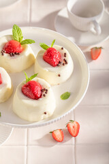 Homemade and delicious monoportion cheesecake with strawberries and sprinkles.