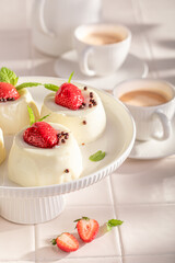 Tasty and homemade monoportion cheesecake served with coffee in summer.
