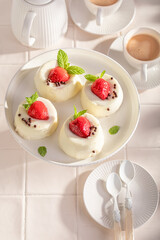 Sweet and chilly monoportion cheesecake with strawberries and sprinkles.