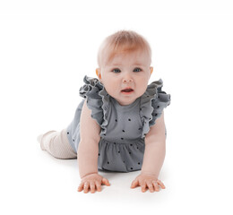 Cute little baby crawling on white background