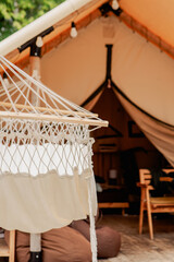 Luxury Glamping Experience with Hammock and Tent on a Wooden Deck