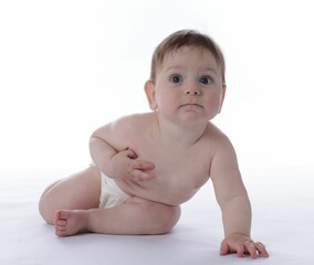 Cute little baby crawling on white background