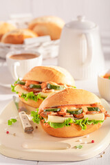 Homemade and delicious sandwich made of chicken, cheese and cucumber.