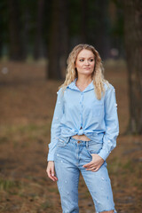 Stylish Young Woman Posing in Forest Park