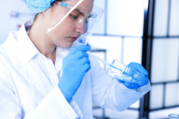 Scientist working with sample in Petri dish in laboratory