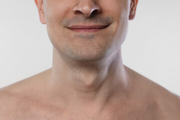 Obraz premium Man after shaving on white background, closeup